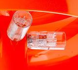 Artemide Nessino Orange. Lampe de table avec abat-jour. Luminaire en polycarbonate à émission de lumière diffuse. Fabriqué en Italie [Classe énergétique A]