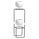 UMBRA Nesta freestand. Porte Plante Nesta. En céramique et métal. Coloris noir et blanc moucheté gris. Dimension 21.8x21.8x70cm